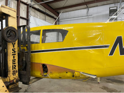 Photograph 2 – Left Side View of Aft Fuselage. Note large Dent, from the NTSB investigation of Piper PA-24-250 accident near North Kingstown, Rhode Island, March 30, 2024