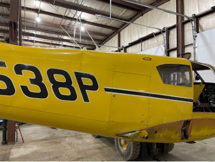 Photograph 3 – Right Side if Aft Fuselage. Note Compression Wrinkle in Fuselage Skin, from the NTSB investigation of Piper PA-24-250 accident near North Kingstown, Rhode Island, March 30, 2024