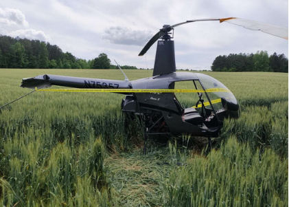 Photo 1 – View of helicopter with severed tail boom, from the NTSB investigation of Robinson Helicopter R22 BETA accident near Louisburg, North Carolina, April 30, 2024