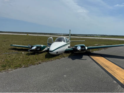Photograph 1 – Accident Airplane Off Runway, from the NTSB investigation of Beech 95B55 accident near St. Augustine, Florida, April 1, 2024