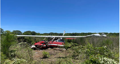Photograph 1 – View of airplane in field showing damage to the wings and fuselage. (FAA Photo), from the NTSB investigation of Cessna 177 accident near Selma, Alabama, May 19, 2024