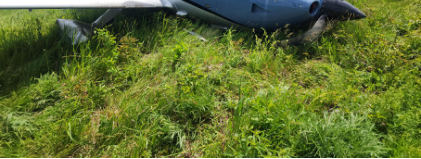Photograph 1 – New York State Police Digital Photograph. Right Forward Quartering View of the Airplane At the Accident Site, from the NTSB investigation of Cirrus Design CORP SR20 accident near Lagrangeville, New York, May 17, 2024