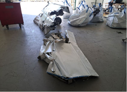 Photograph 4 – View of left wing at hangar facility (NTSB), from the NTSB investigation of Piper PA-28-151 accident near Hope Mills, North Carolina, May 26, 2024