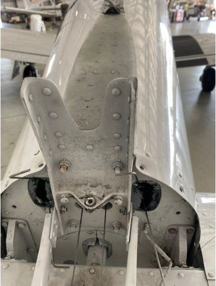 INVESTIGATIVE PHOTOS Photograph 3 – Aft mounting bracket, 17 fractured rivets, from the NTSB investigation of Piper PA28R accident near Vero Beach, Florida, June 7, 2024