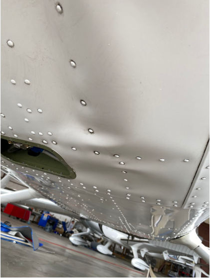 Photograph 2 – Postaccident lower fuselage damage, from the NTSB investigation of Textron Aviation Inc 172 accident near Chesapeake, Virginia, June 13, 2024