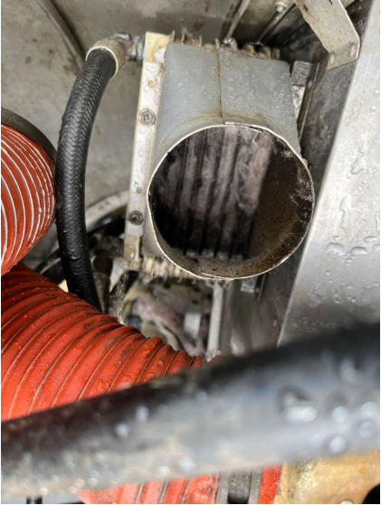 Photograph 2 – oil cooler obstructed with a residential-type insulation, from the NTSB investigation of Cessna 172 accident near Lewiston Woodville, North Carolina, June 29, 2024