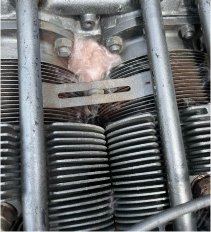Photograph 4 – Residential-type insulation noted in engine area, from the NTSB investigation of Cessna 172 accident near Lewiston Woodville, North Carolina, June 29, 2024
