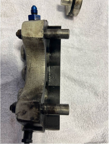 Photograph 7 – Disassembled right brake caliper, from the NTSB investigation of Cessna A185F accident near Rural Retreat, Virginia, July 21, 2024