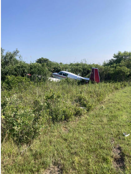 Photograph 1 – Airplane at accident site, from the NTSB investigation of Mooney M20J accident near Montauk, New York, July 14, 2024