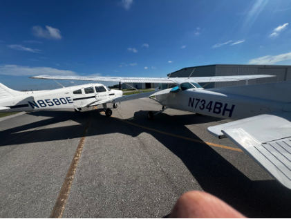 Photograph 1 – Postaccident view of airplanes’ collision, from the NTSB investigation of Cessna 172N and Piper PA-28-161 accident near Immokalee, Florida, July 28, 2024