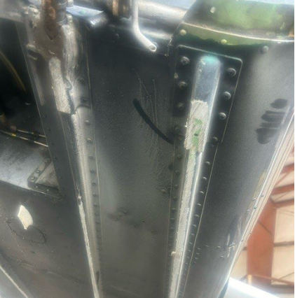 Photograph 2 – Damage to external longerons, from the NTSB investigation of Piper PA-32R-301T accident near North Myrtle Beach, South Carolina, July 30, 2024