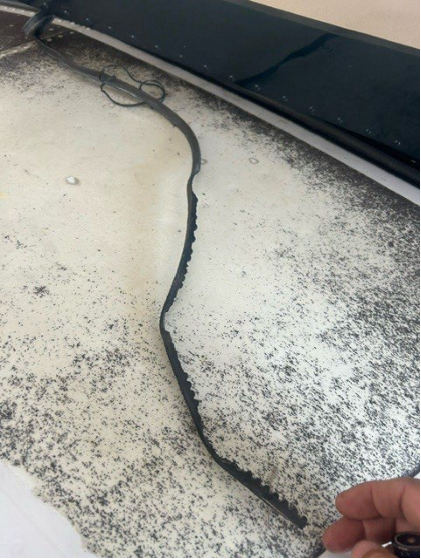 Photograph 4 – Shredded alternator belt, from the NTSB investigation of Piper PA-32R-301T accident near North Myrtle Beach, South Carolina, July 30, 2024