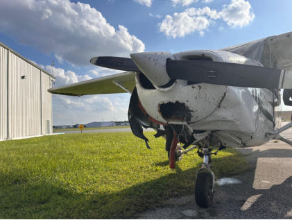 Photograph 2 – Fuselage and engine compartment damage., from the NTSB investigation of Cessna 172 accident near Orlando, Florida, August 16, 2024
