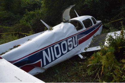Photograph 3 – FAA Digital Photograph. Right Rear Quartering View of the Airplane At the Accident Site. Note the Compression Wrinkles in the Right Side of the Aft Fuselage, from the NTSB investigation of Mooney M20K accident near Fairmont, West Virginia, August 30, 2024
