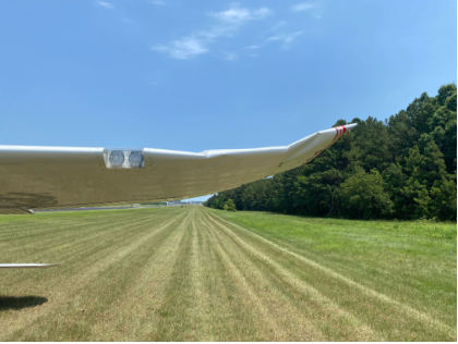 INVESTIGATIVE PHOTOS Photograph 1 – left wing tip bent up, from the NTSB investigation of Cessna 170B accident near Smithfield, North Carolina, June 16, 2024