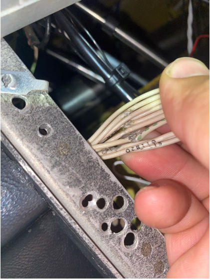 Photograph 2 – Chafed gear switch wires, from the NTSB investigation of Beech 58 accident near Raleigh, North Carolina, September 8, 2024
