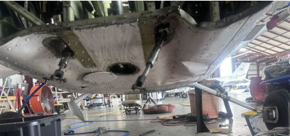 Photograph 1 – Lower fuselage impact damage, from the NTSB investigation of Cessna 172 accident near St. Augustine, Florida, May 17, 2024
