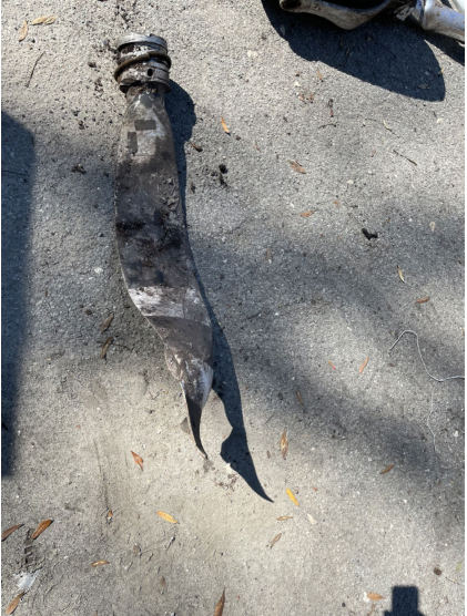 Photograph 6 – View of damaged propeller blade. (NTSB), from the NTSB investigation of Cessna 208 accident near Pierson, Florida, February 14, 2025