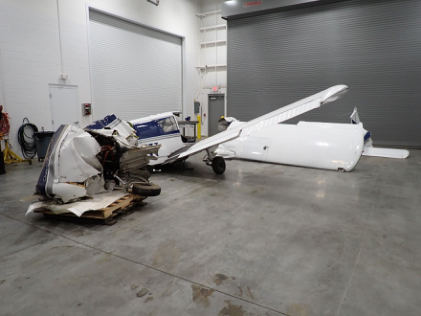 Photograph 8 – Airplane overview after recovery to AMF, from the NTSB investigation of Piper PA28 accident near Louisville, Kentucky, October 11, 2024