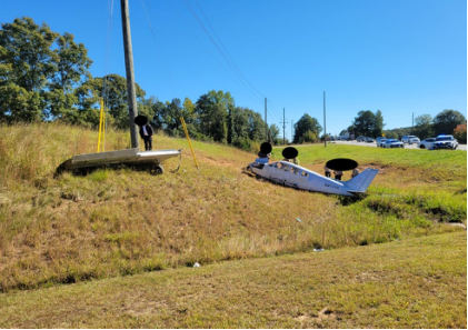 Photograph 1 – View of left profile side of airplane at accident site., from the NTSB investigation of Piper PA-28-151 accident near Newnan, Georgia, October 16, 2024