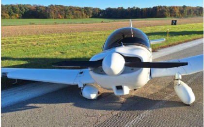 Photograph 1 – View of airplane looking aft showing damage to landing gear and airframe., from the NTSB investigation of Amateur-built 601 HDS accident near Altoona, Pennsylvania, October 17, 2024