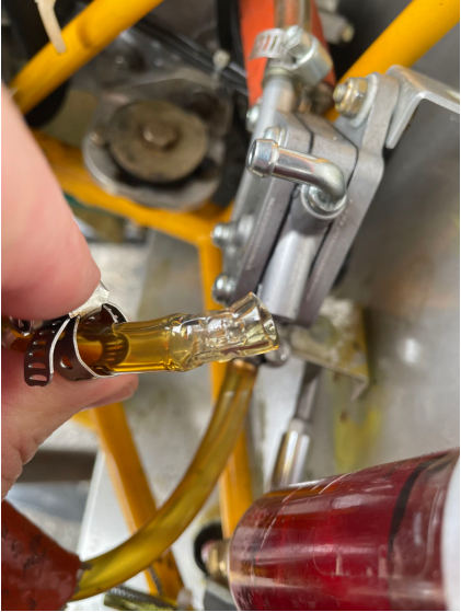 Photograph 3 – Split noted to fuel line, from the NTSB investigation of Amateur-built Kitfox 4 accident near New Castle, Pennsylvania, November 2, 2024