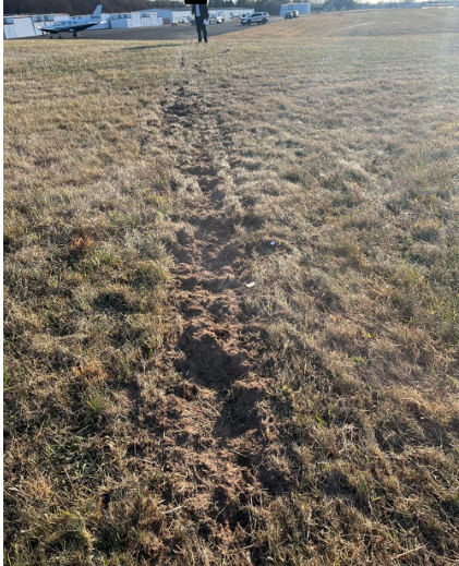 ON SCENE PHOTOGRAPHS Photograph 4 – Ground scar looking toward the wreckage site, from the NTSB investigation of Beech A36 accident near Doylestown, Pennsylvania, November 18, 2024