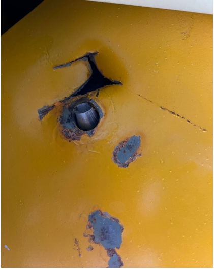 Photograph 4 – Postaccident damaged landing gear attach plate with bolt half, from the NTSB investigation of Amateur-built BAKENG DUCE accident near Plant City, Florida, November 17, 2024
