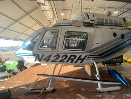 Photograph 3 – Left side view of helicopter showing landing skid damage, from the NTSB investigation of Bell 206B accident near Lakeland, Florida, November 21, 2024
