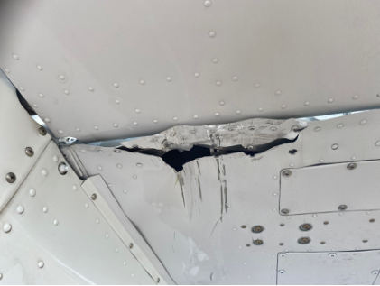 Photograph 4 – bottom right horizontal stabilizer accident damage, from the NTSB investigation of Cessna P210 accident near Ball Ground, Georgia, November 7, 2024