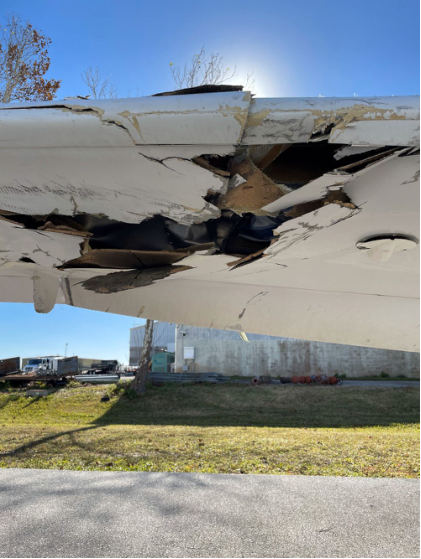Photograph 3 – Accident Damage, Lower Forward Right Wing, from the NTSB investigation of Diamond Aircraft Ind GMBH DA 42 NG accident near Daytona Beach, Florida, November 15, 2024