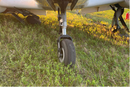 Photograph 4 – Postaccident Undercarriage, from the NTSB investigation of Diamond Aircraft Ind GMBH DA 42 NG accident near Daytona Beach, Florida, November 15, 2024