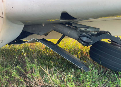 Photograph 5 – Collapsed Right Main Gear Leg, from the NTSB investigation of Diamond Aircraft Ind GMBH DA 42 NG accident near Daytona Beach, Florida, November 15, 2024