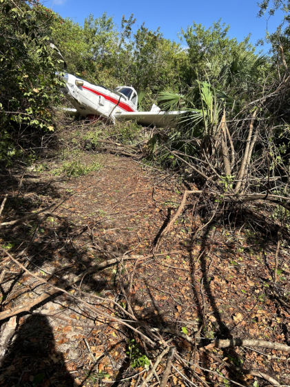 Photograph 1 – View of the airplane at the accident site., from the NTSB investigation of Air Tractor AT504 accident near Big Cypress, Florida, December 18, 2024