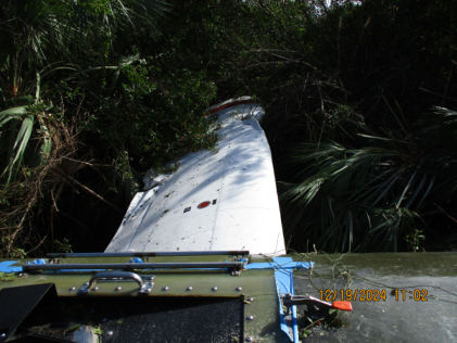 Photograph 4 – View of damage to the left wing., from the NTSB investigation of Air Tractor AT504 accident near Big Cypress, Florida, December 18, 2024