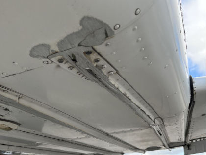 Photograph 8 – Abrasion Damage to External Longerons on the Bottom of the Fuselage., from the NTSB investigation of Piper PA-44-180 accident near Pompano Beach, Florida, January 10, 2025