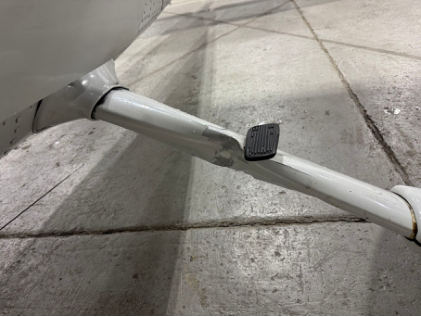 Photograph 4 – Left main landing gear accident damage, from the NTSB investigation of Cessna 182 accident near Smyrna, Tennessee, January 17, 2025