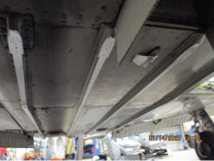 Photograph 2 – Lower fuselage accident damage, from the NTSB investigation of Piper PA44 accident near Fairfield, New Jersey, January 12, 2025