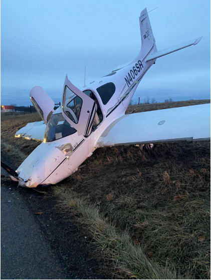 Photograph 2 – FAA Digital Photograph. Left Forward Quartering View of the Airplane at the Accident Site, from the NTSB investigation of Cirrus Design CORP SR22 accident near New Lexington, Ohio, February 5, 2025