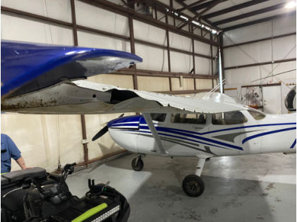 Photograph 1 – View of damaged left wing., from the NTSB investigation of Cessna 172P accident near Clarksville, Tennessee, February 3, 2025