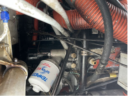 Photograph 2 – Oil filter and adapter, from the NTSB investigation of Cessna 172C accident near Argyle, New York, February 20, 2025