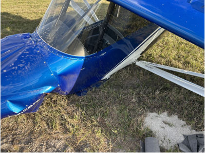Photograph 1 – Left gear collapsed, folded under fuselage, from the NTSB investigation of C K Ing Adventure LLC CCX-2000 accident near Okeechobee, Florida, February 23, 2025