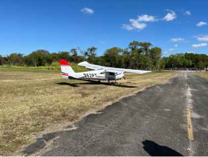 Photograph 1 – Deformation noted to left wing, from the NTSB investigation of Cessna Aircraft CO 162 accident near Miami, Florida, March 19, 2025