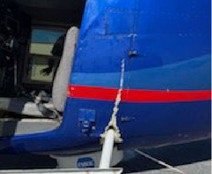 Photograph 2 – Left Side Fuselage Damage, from the NTSB investigation of Bell 206 accident near Chamblee, Georgia, March 21, 2025