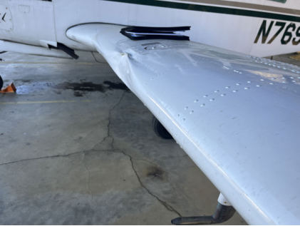 Photograph 1 – Left-Wing Leading-Edge Damage, from the NTSB investigation of Beech E33 accident near Lenoir, North Carolina, February 25, 2025
