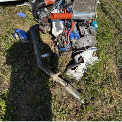 Photograph 3 – Engine, note: Air discharge duct missing., from the NTSB investigation of Diamond Aircraft Ind INC DA 40 NG accident near Sanford, North Carolina, May 7, 2025