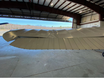 Photograph 2 – Deformation noted to the left wing, from the NTSB investigation of Cessna 170 accident near Oxford, Maine, April 18, 2025
