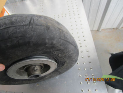 Photograph 7 – Nose wheel showing no rim damage, from the NTSB investigation of Cessna 177B accident near Calera, Alabama, June 24, 2025
