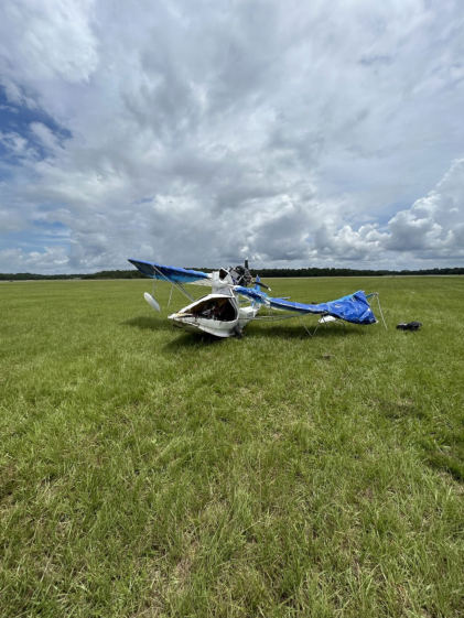 Photograph 1 – View of the airplane at the accident site., from the NTSB investigation of Amateur-built Aventura II accident near Deland, Florida, July 3, 2025