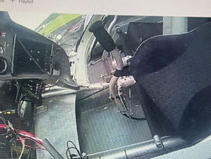 Photograph 3 – View of the seat cushion strap around control stick., from the NTSB investigation of Amateur-built Aventura II accident near Deland, Florida, July 3, 2025